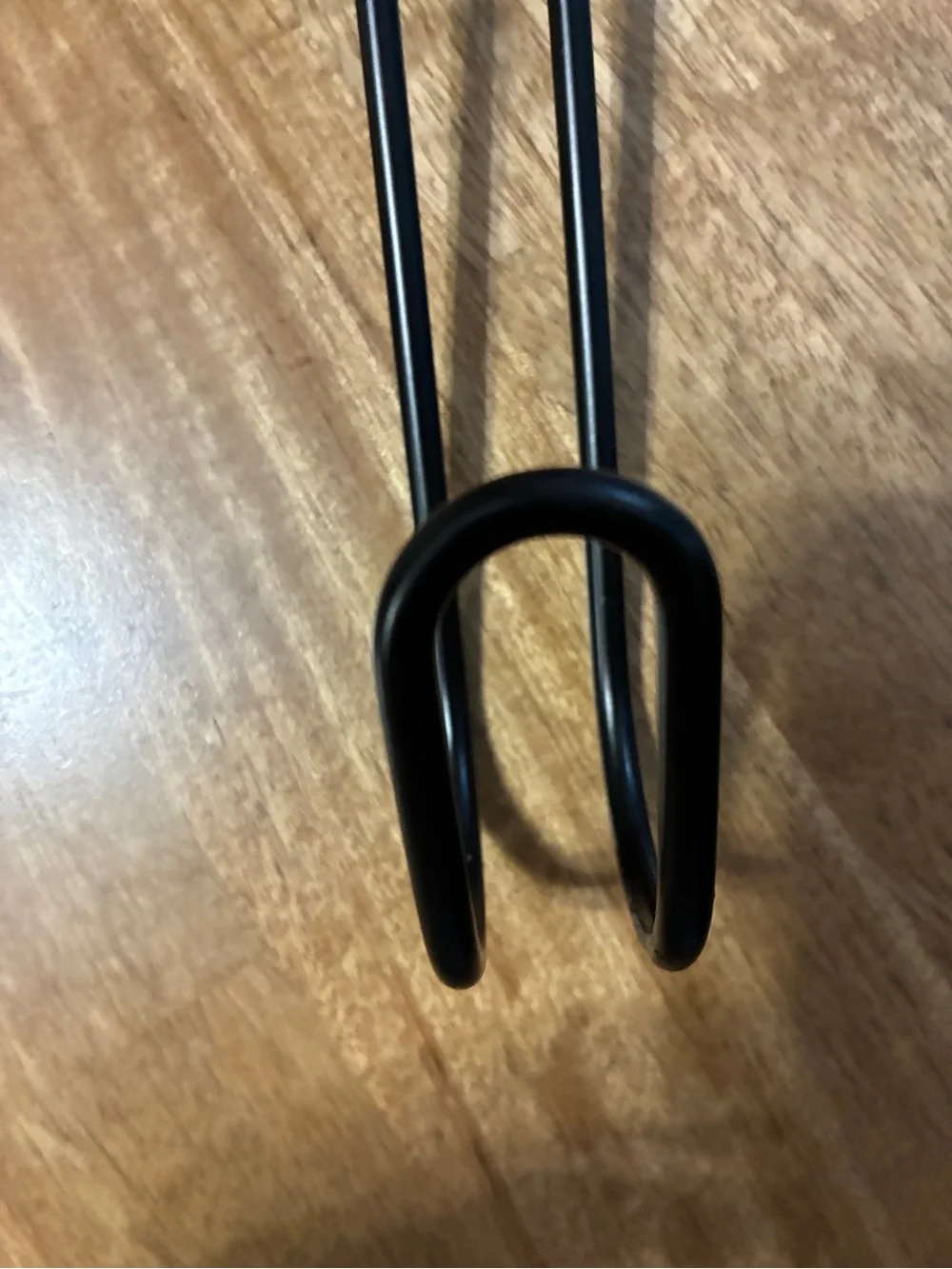 Black metal scroll wreath hanger for door